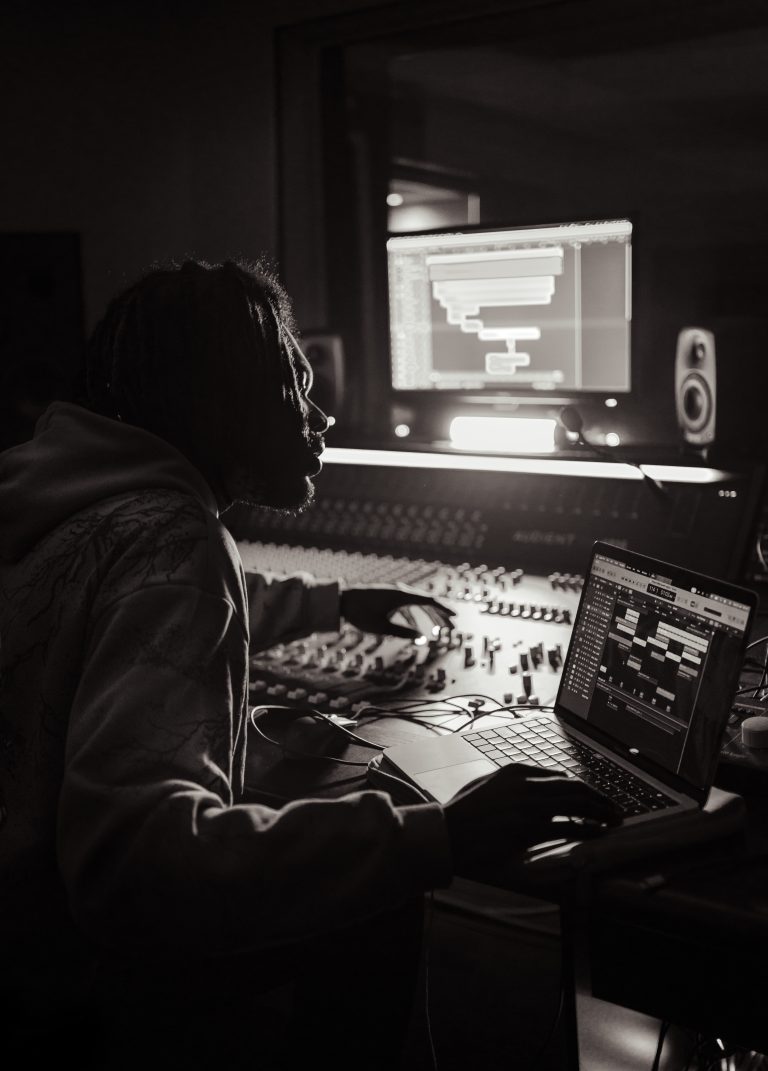 Producer SepticWRLD working in the studio in black and white