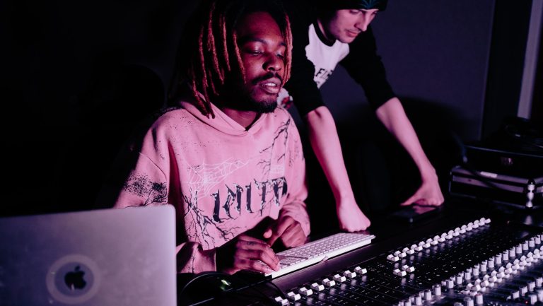 SepticWRLD in the studio with a friend showing him his current work