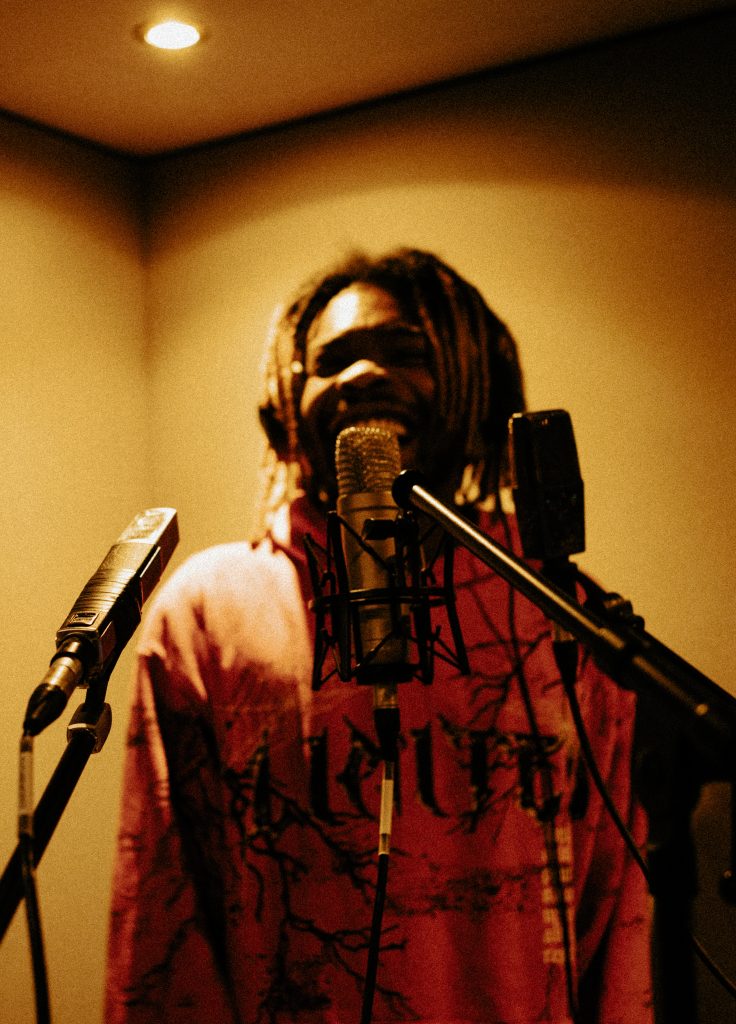 Septic WRLD in the live room testing out various microphones